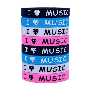 Colorful I Love Music silicone wristbands stacked on white background for music festivals