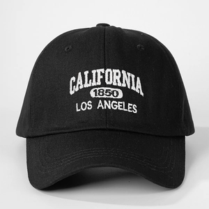 Detailed close-up of white 3D California embroidery on high-density black twill cap
