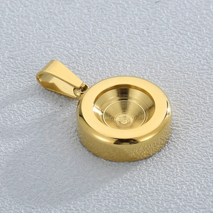 Detailed macro view of a gold-plated stainless steel cylindrical charm base with setting