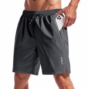 Detailed view of quick-dry shorts featuring secure side zipper pockets and elastic drawstring