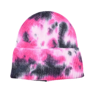 Fashionable tie-dye knit beanie in pink and black with ribbed texture for outdoor sports