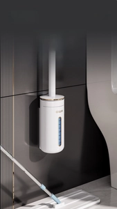 Wall-mounted white and gold disposable toilet brush holder with modern sleek design