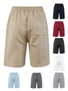 Detail view of men's casual waffle knit shorts showing multiple colors and diamond texture