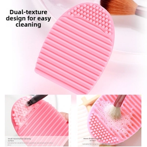 Detailed view of pink silicone makeup brush cleaner with dual textured scrubbing surfaces