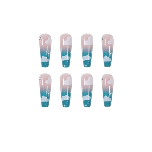 Blue gradient coffin fake nails with cloud patterns and rhinestones on white background