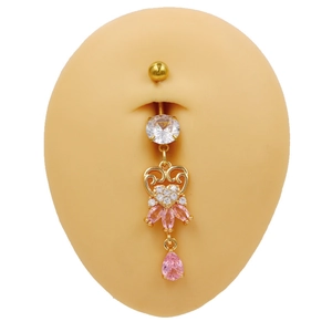 Detailed view of gold hollow heart belly ring with pink marquise zircon on a silicone model