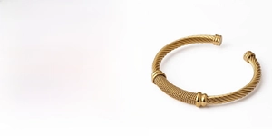 Detail of 18K gold plated mesh woven stainless steel open cuff bracelet texture