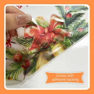 Detail showing the transparent PVC Christmas sticker with adhesive backing and red bow design