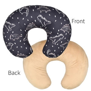 Detail of U-shaped nursing pillow cover with blue dinosaur print and soft velvet back