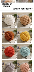 Detailed view of handmade knotted ball pillows in various colors and soft fleece texture