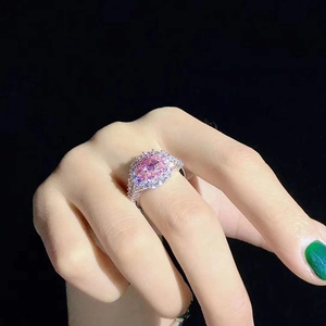Exquisite pink crystal ring with oval gemstone and diamond halo on silver band