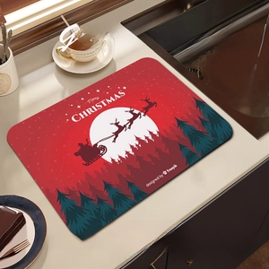 Christmas dish drying mat with red Merry Christmas print and forest silhouette design