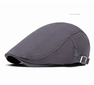 Detail view of the gray flat cap fabric texture and adjustable silver metal side buckle