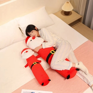 Cozy bedroom scene showing long Santa Claus plush body pillow in two sizes for Christmas