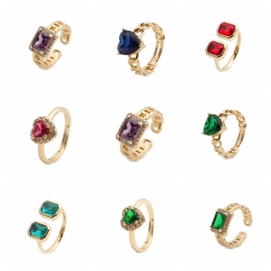 Macro display of colorful enamel heart and rectangle gold rings in a grid layout