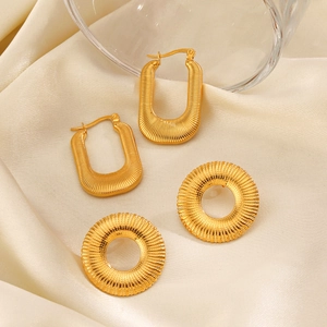 18K gold plated geometric U-shaped and round disc earrings with ribbed texture on satin