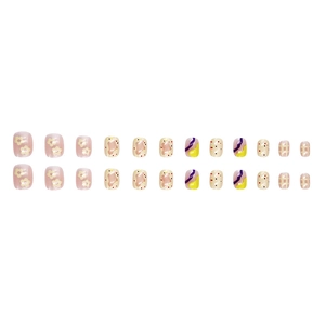 Sweet press-on nails with colorful flowers and dot patterns on a white background