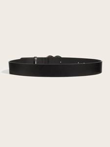 Detailed side view of a black leather punk belt with metal studs and textured finish