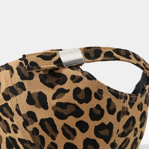 Detail of adjustable metal buckle and leopard print fabric on the baseball cap