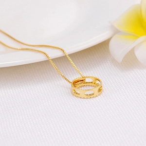 Minimalist gold-plated box chain necklace with a hollow round zircon pendant