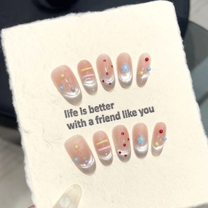 Pink and silver cat-eye press-on nails with colorful 3D dots and floral patterns
