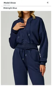 Detail of midnight blue zip-up hoodie set showing ribbed cuffs and drawstring waist