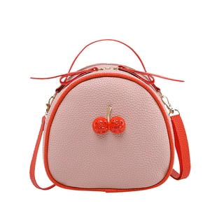 Pink lychee texture mini crossbody bag with cherry decor and red contrast strap