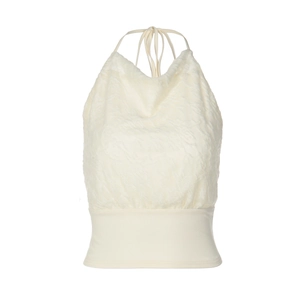 Detail of cream halter top featuring textured lace patchwork and waist tie design
