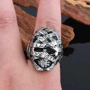 Detailed view of punk mummy skull ring made of stainless steel on a model's hand