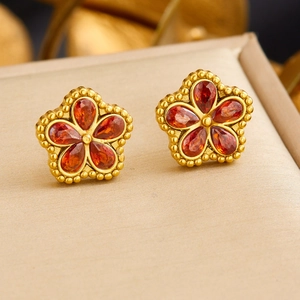 Chic 18K gold-plated stainless steel flower earrings with vibrant orange-red crystals