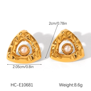 Detail view of irregular gold triangle pearl earrings with size dimensions and weight