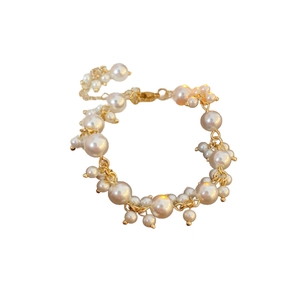 Elegant multi-layered gold chain pearl bracelet with white beads and adjustable lobster clasp