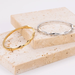 Bamboo style stainless steel bangles with sparkling crystals in gold and silver finish