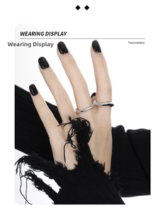 Close-up of minimalist S925 sterling silver wavy ring on finger with artistic style