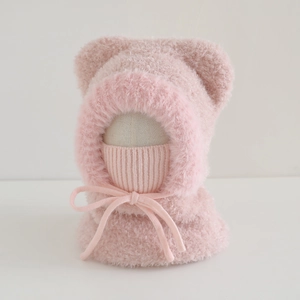 Detail of plush pink kids hooded scarf with bear ears and adjustable knit mask