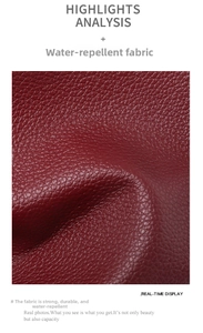Detailed close-up of water-resistant burgundy litchi grain leather on a large shoulder bag