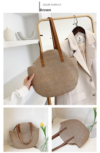 Detail of large straw tote with brown leather strap and cross-stitch reinforcement