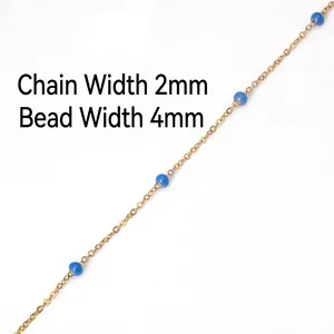 Macro view of 2mm gold chain with 4mm translucent blue beads for DIY jewelry making