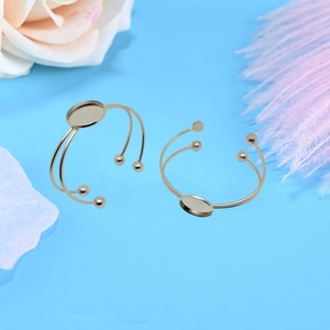 Macro view of silver stainless steel C-shaped bangle with round bezel tray for DIY jewelry