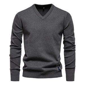 Detailed view of the V-neckline and rib-knitted texture on this grey men's cotton sweater