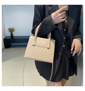 Chic beige faux leather tote bag with geometric embossed pattern and dual carry straps