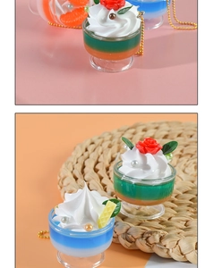 Macro detail of artificial cream dessert sundae keychain with waffle and orange slices