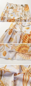 Detail of starfish and shell print on ruffled hem with elastic waist for swimwear