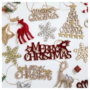 Flat lay of red flocked and gold star wooden Christmas ornaments with reindeer and snowflakes