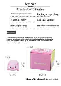 Pink resin pig ornament detail showing the mini sprawl animal and branded packaging