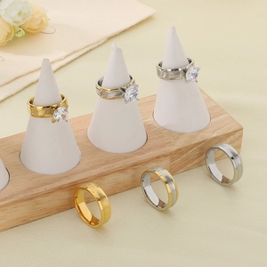 Polished stainless steel rings in gold and silver finish with round cut cubic zirconia