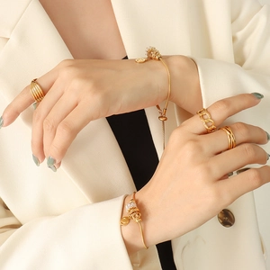 Gold plated titanium steel jewelry set featuring zircon bracelets and chunky rings for women