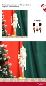 Detailed view of 36cm gold and silver wooden nutcracker soldier with sequined crown