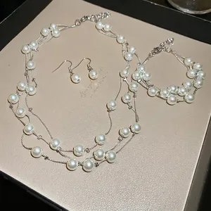 Three-layer irregular pearl necklace with matching bracelet and earrings jewelry set