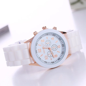 Detail of white Geneva silicone strap watch with rose gold metal case and white dial face